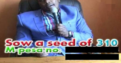 A man in a shirt and suit jacket, seated at a table, holding a microphone. Subtitle text reads: “Sow a seed of 310. M-pesa no: followed by two black rectangles where the m-pesa numbers have been blacked out.”